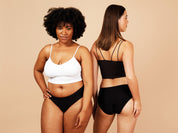 two women wearing one size stretch period pants