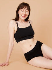 Comfortable period briefs, woman relaxing and smiling.