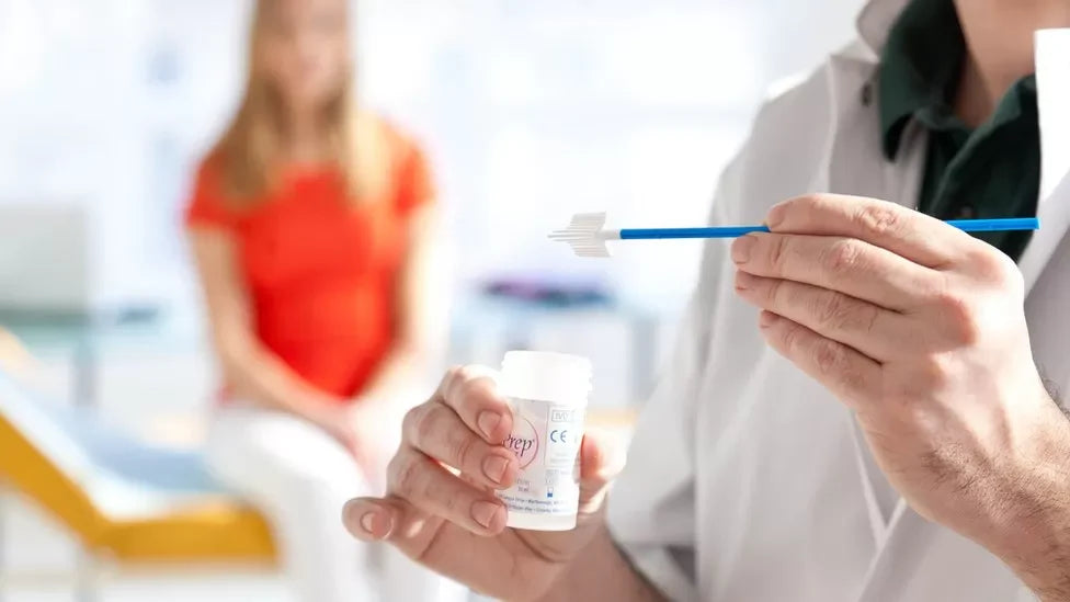 Woman sitting in a doctor's office preparing for her first pap smear test.
