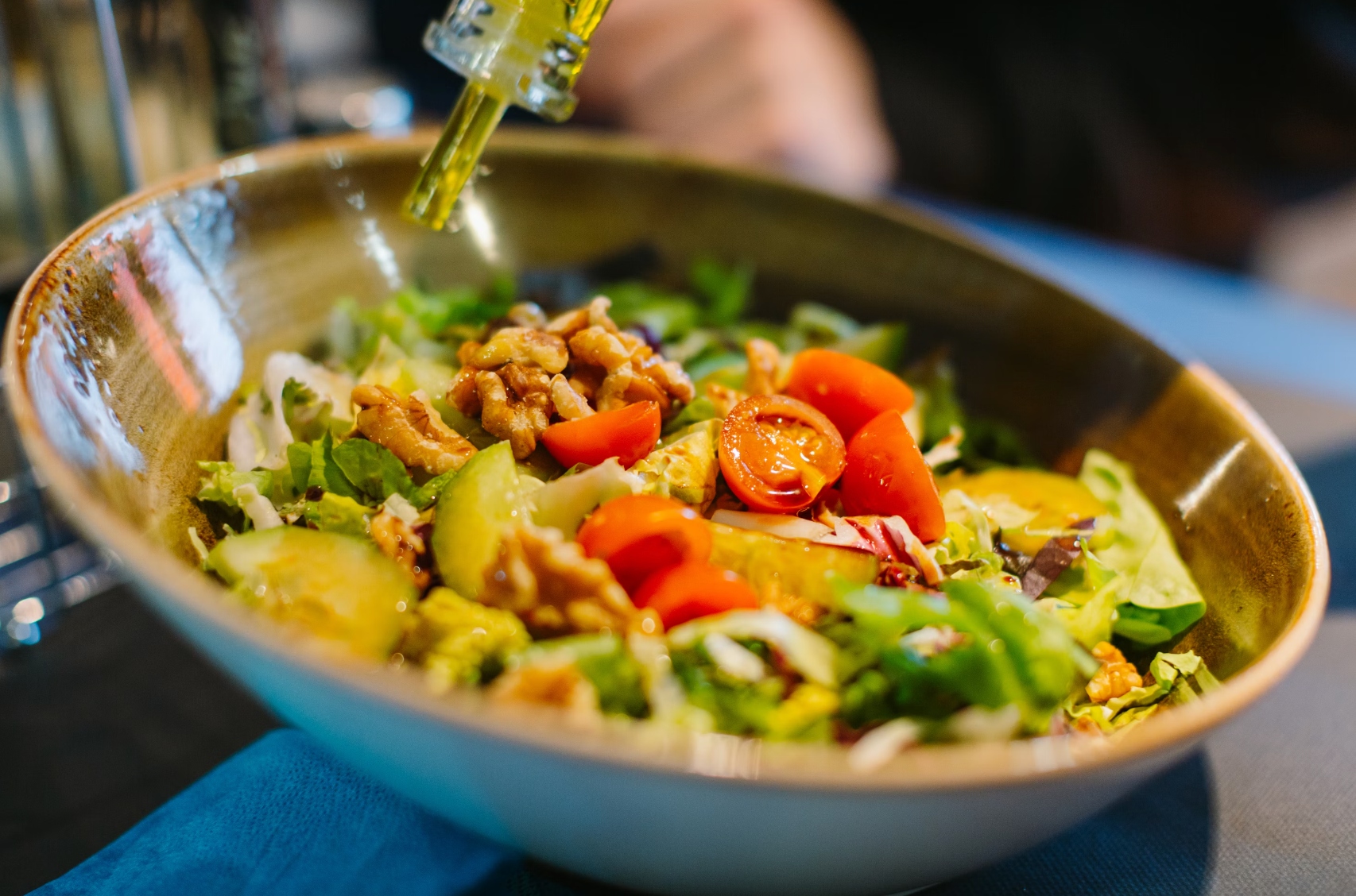 Close-up of a healthy green salad bowl with leafy greens and vegetables.